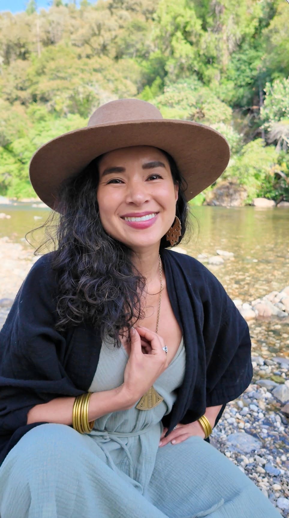 Aimi Colibrí, Jungian coach, outdoors by a river