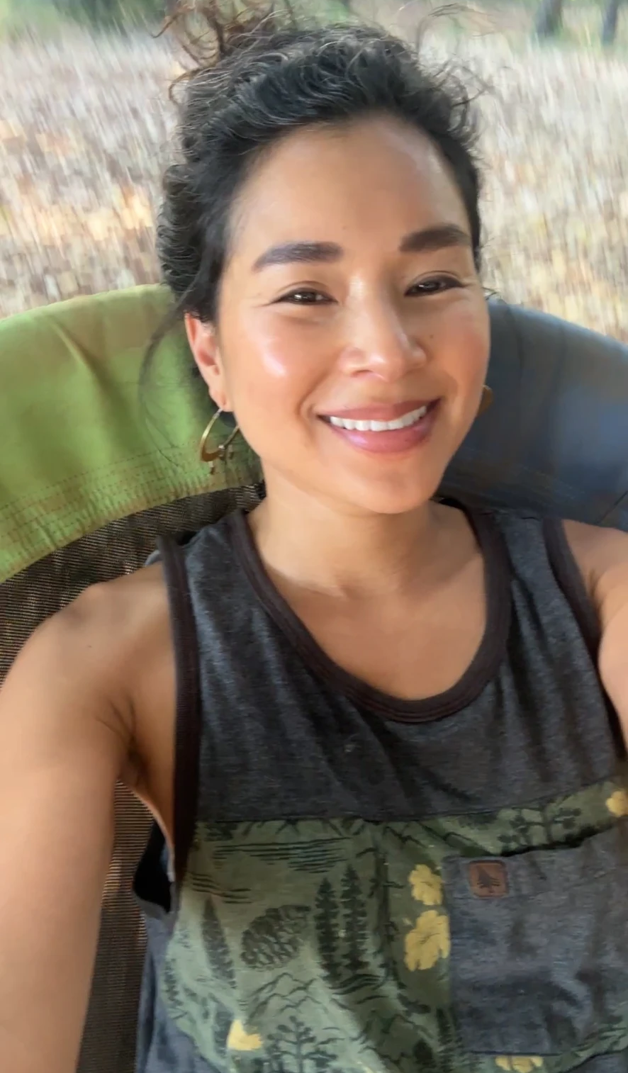 Aimi smiling on a swing