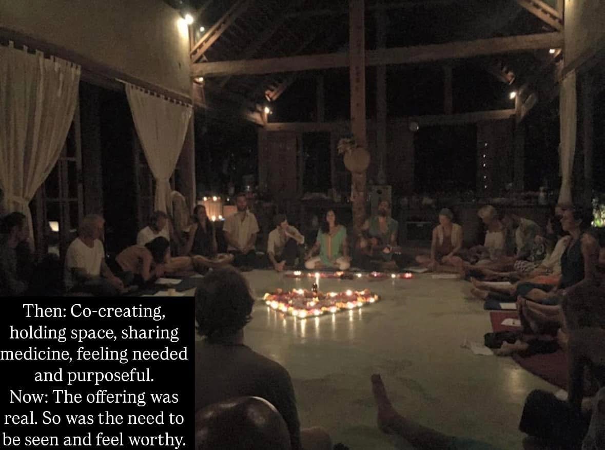 Candlelit ceremony circle with people seated around a heart of candles