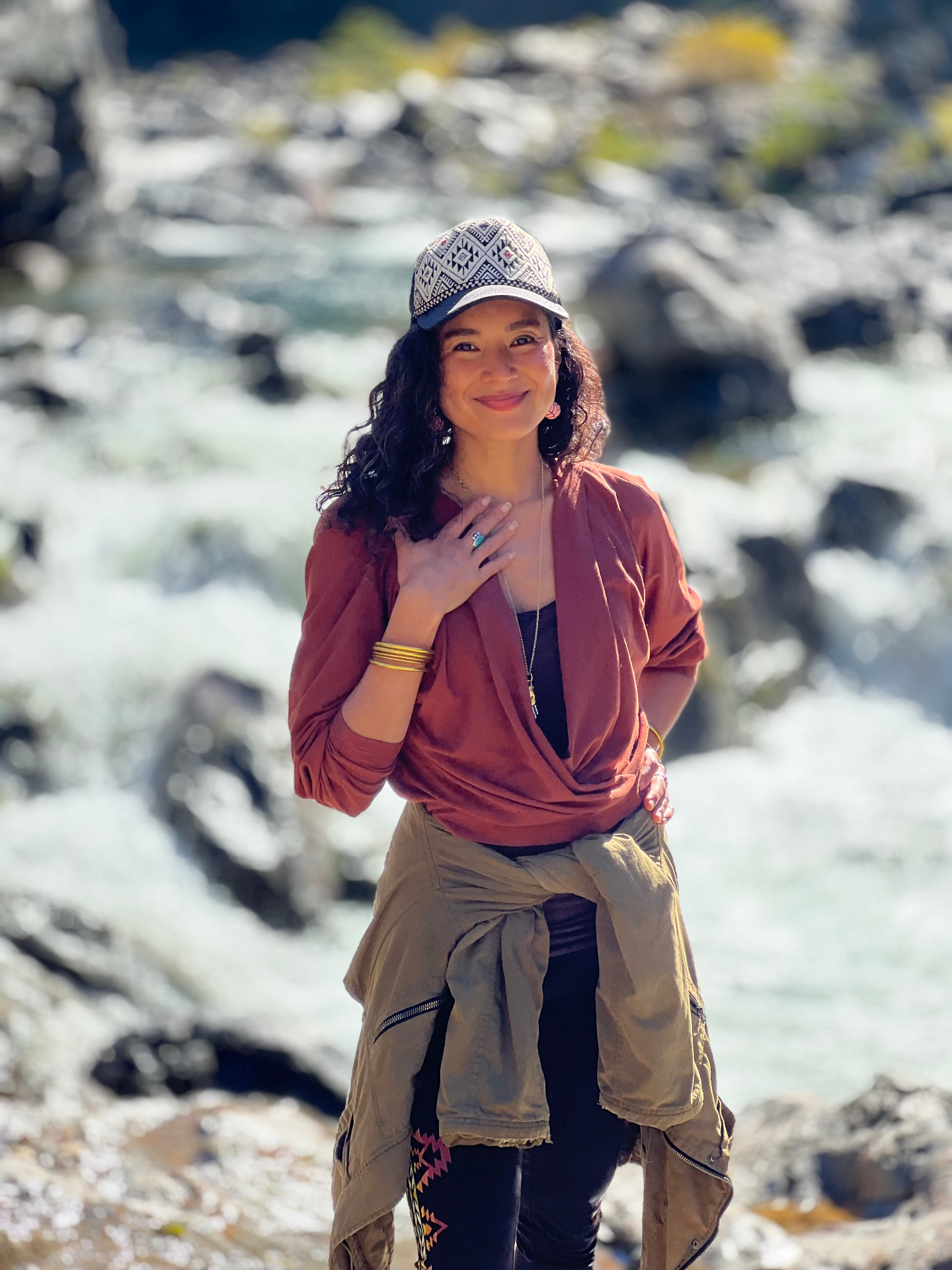 Aimi Colibrí standing by the Yuba river